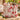 Anthurium Bloom cotton tote bag in cream color with front pocket in a poolside setting