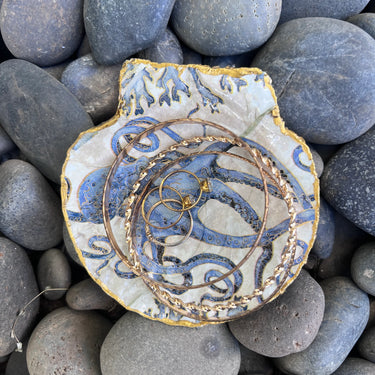 Blue octopus seashell dish holding rings and jewelry trinkets